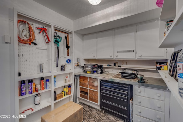 kitchen featuring light countertops and white cabinetry