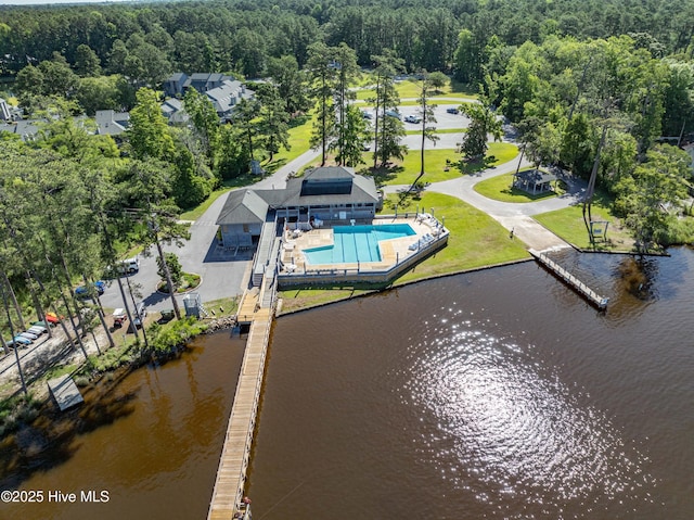 aerial view featuring a view of trees and a water view