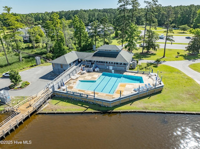 birds eye view of property with a water view