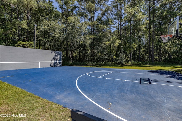 view of sport court with community basketball court and a lawn