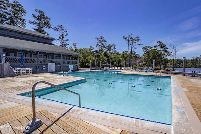 community pool with a patio area