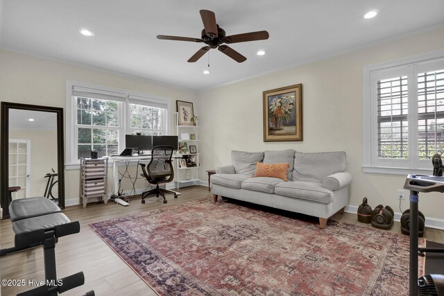 office featuring recessed lighting, baseboards, wood finished floors, and a ceiling fan
