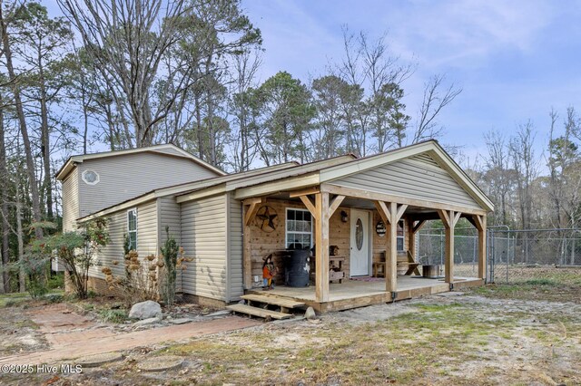 exterior space featuring a gate and fence