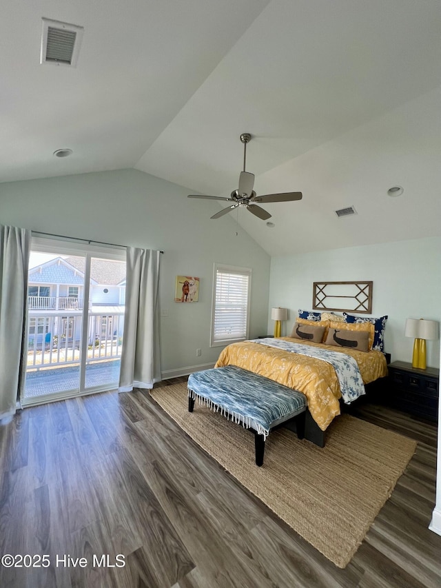 bedroom with vaulted ceiling, access to outside, wood finished floors, and visible vents