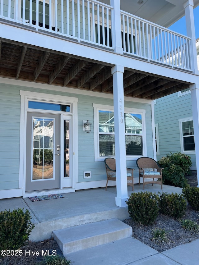 property entrance with covered porch