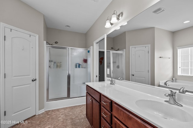 full bath featuring a stall shower, visible vents, and a sink