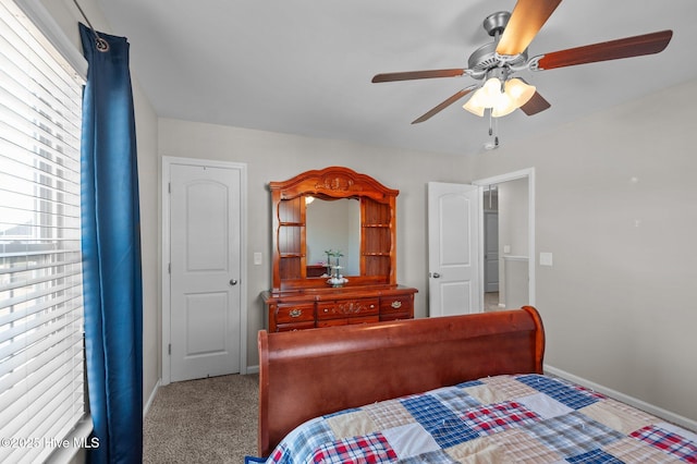 carpeted bedroom with baseboards and a ceiling fan