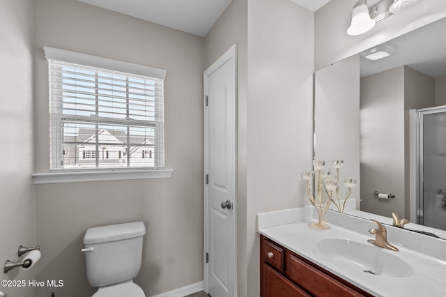 full bath featuring a stall shower, a closet, vanity, and toilet