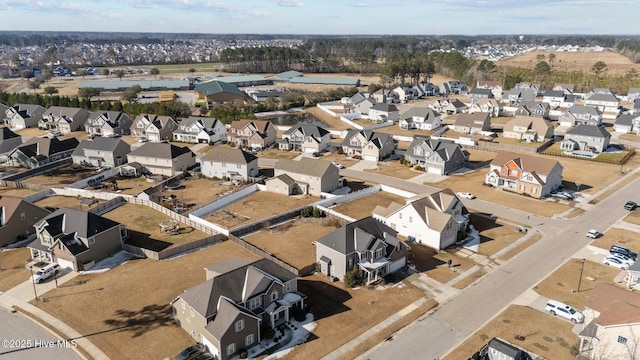 birds eye view of property with a residential view