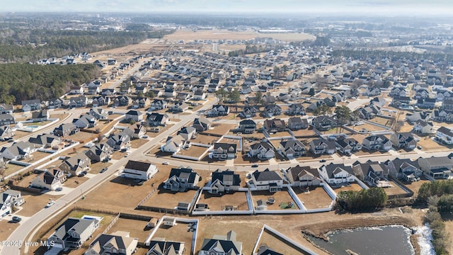 birds eye view of property with a residential view