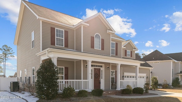 view of front of home with a garage and a porch