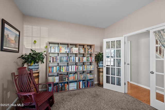 sitting room with carpet, baseboards, and french doors