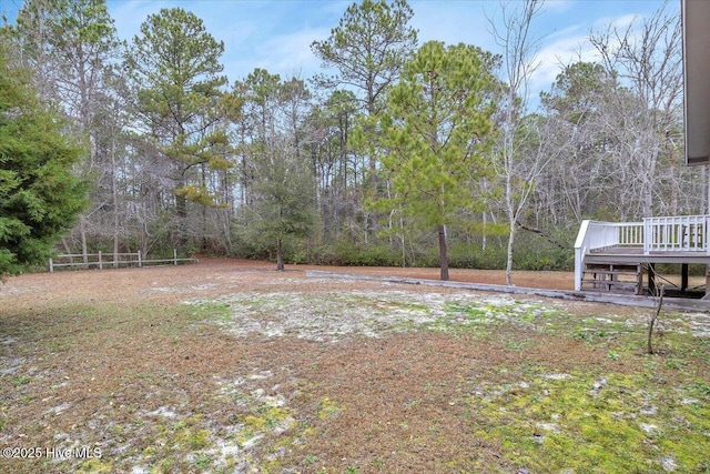 view of yard featuring a wooden deck