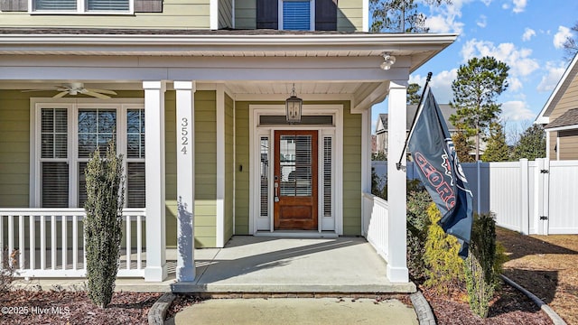 property entrance featuring ceiling fan and a porch