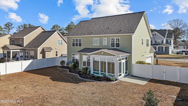 back of house with a sunroom