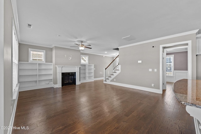 unfurnished living room featuring crown molding, dark hardwood / wood-style flooring, and ceiling fan