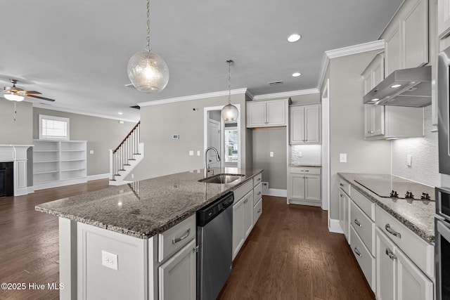 kitchen featuring a kitchen island with sink, hanging light fixtures, sink, stainless steel dishwasher, and black electric cooktop