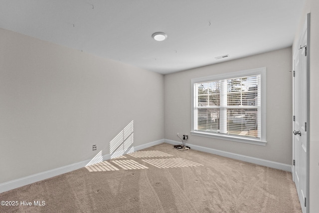 view of carpeted spare room