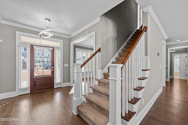 entrance foyer with crown molding and dark hardwood / wood-style flooring