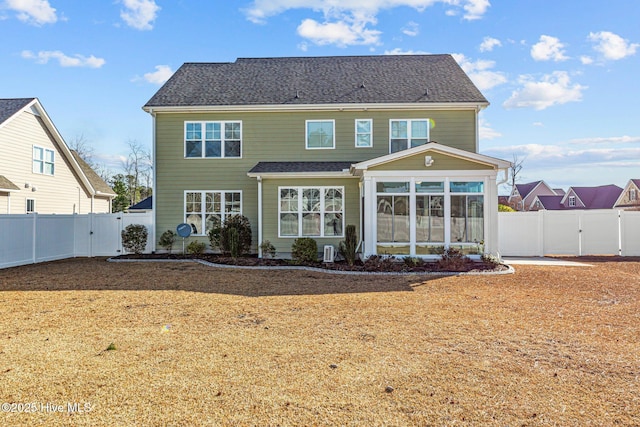 back of house featuring a sunroom