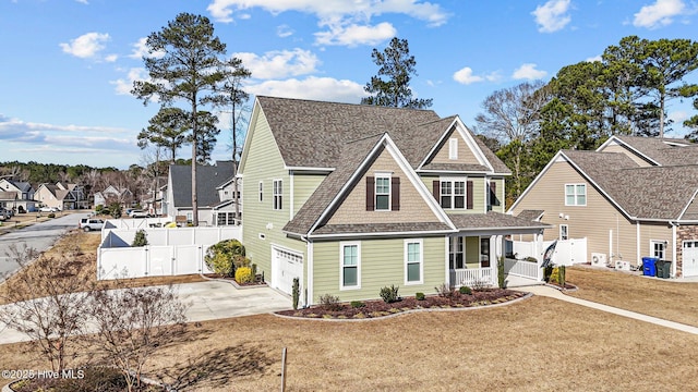 view of front facade featuring a garage, a front lawn, and a porch