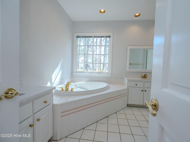 bathroom featuring recessed lighting, a garden tub, tile patterned flooring, and vanity