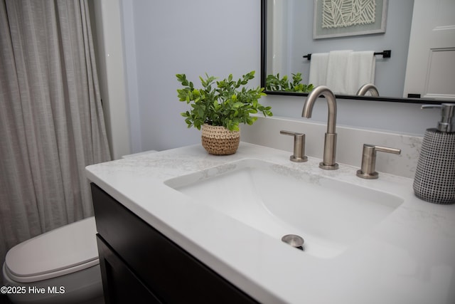 bathroom with vanity and toilet