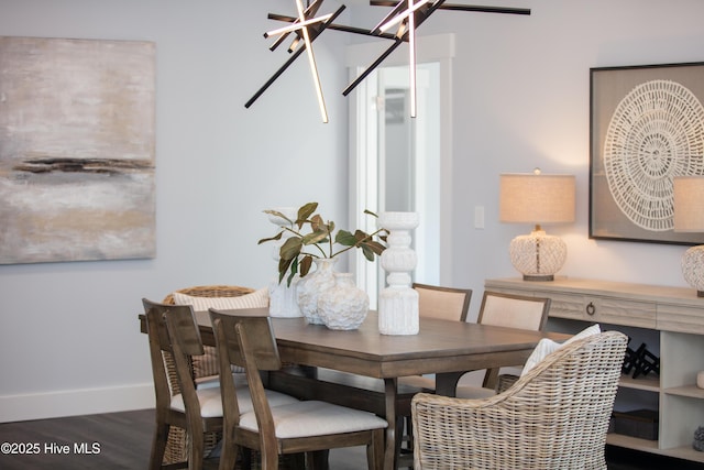 dining space featuring dark hardwood / wood-style flooring