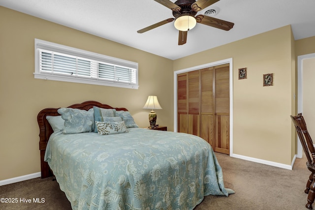 bedroom featuring a ceiling fan, a closet, baseboards, and carpet flooring