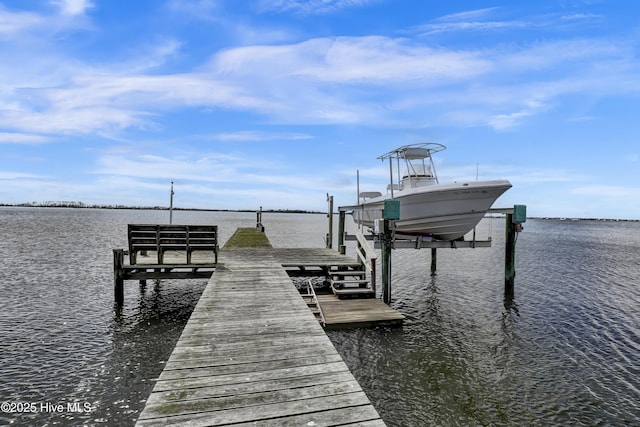 view of dock featuring a water view and boat lift