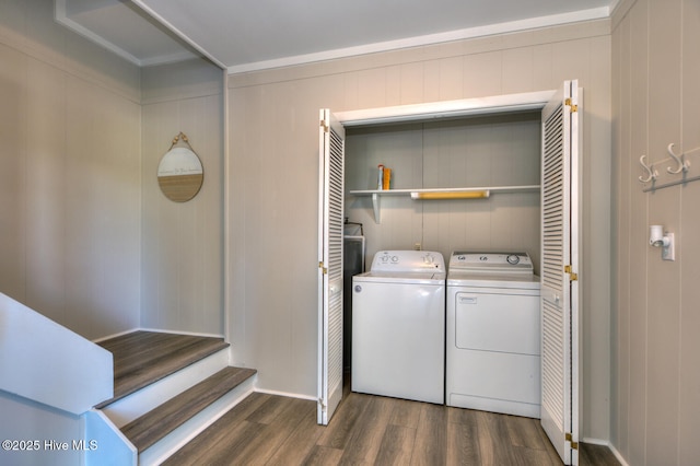 laundry room featuring dark hardwood / wood-style flooring and washing machine and clothes dryer