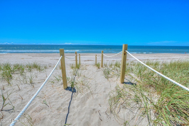 property view of water featuring a beach view