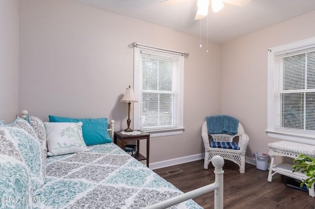 bedroom with dark wood-type flooring and ceiling fan