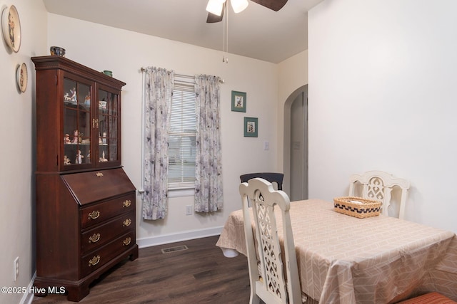 dining area featuring dark wood-type flooring and ceiling fan