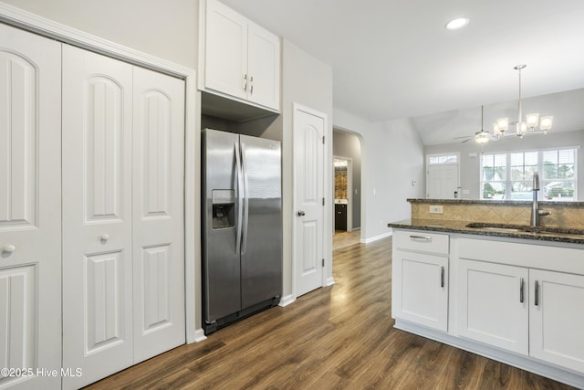 1180 Red Bay Pl, Leland, NC 28451 - kitchen featuring stainless steel fridge, a sink, white cabinets, and dark wood-style floors