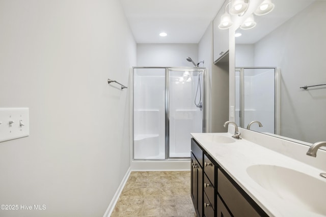 1180 Red Bay Pl, Leland, NC 28451 - full bath with a sink, baseboards, a shower stall, and double vanity