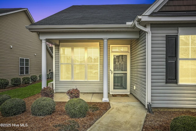 exterior entry at dusk with a porch