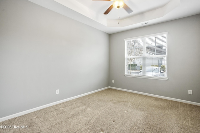 1180 Red Bay Pl, Leland, NC 28451 - spare room featuring ceiling fan, a raised ceiling, carpet, baseboards, and visible vents