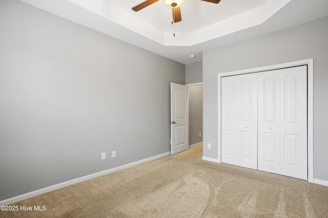 1180 Red Bay Pl, Leland, NC 28451 - unfurnished bedroom featuring a raised ceiling, baseboards, carpet, and a closet