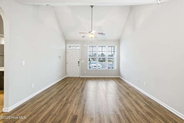 1180 Red Bay Pl, Leland, NC 28451 - unfurnished living room with baseboards, arched walkways, a ceiling fan, and wood finished floors