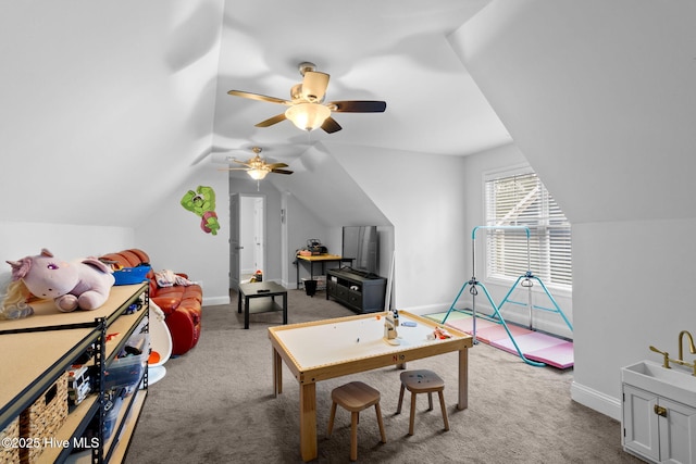 rec room featuring lofted ceiling and carpet floors