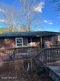 rear view of property with a deck