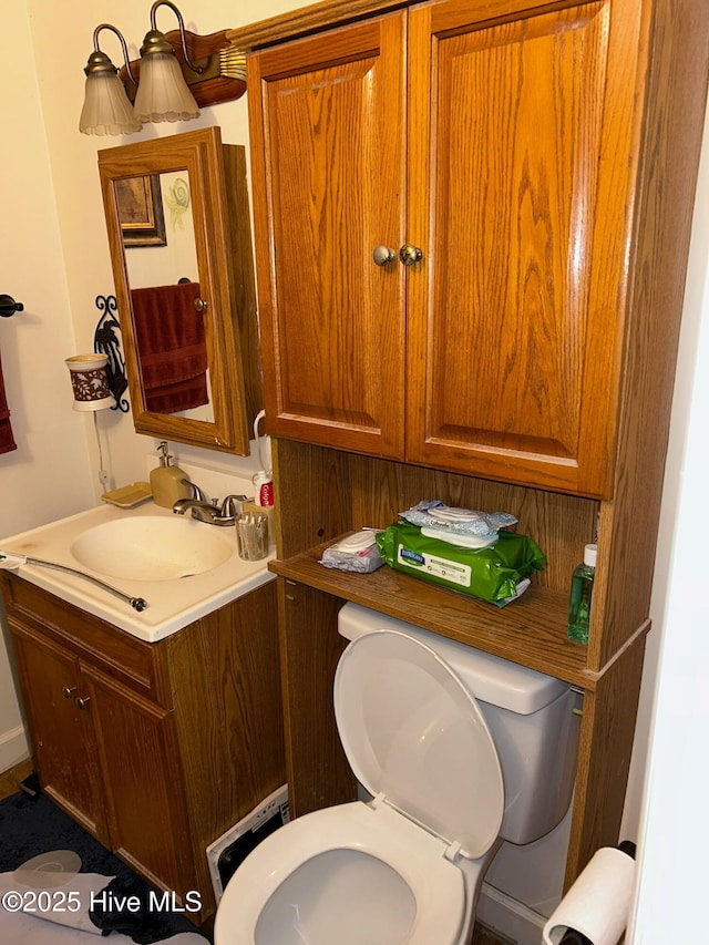 half bath with toilet and vanity