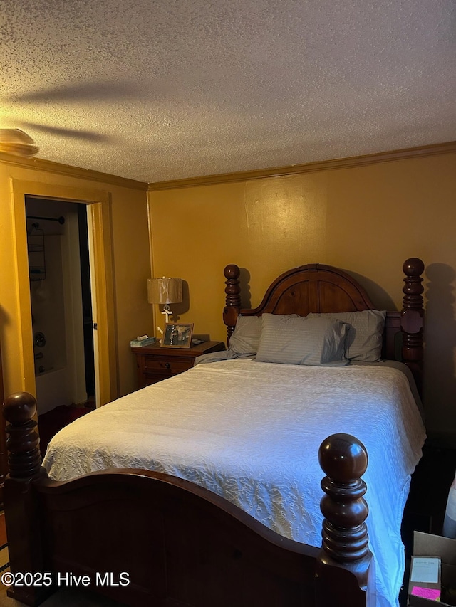 bedroom featuring a textured ceiling, crown molding, and ceiling fan