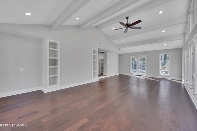 unfurnished living room with dark wood-style floors, built in shelves, french doors, vaulted ceiling with beams, and baseboards