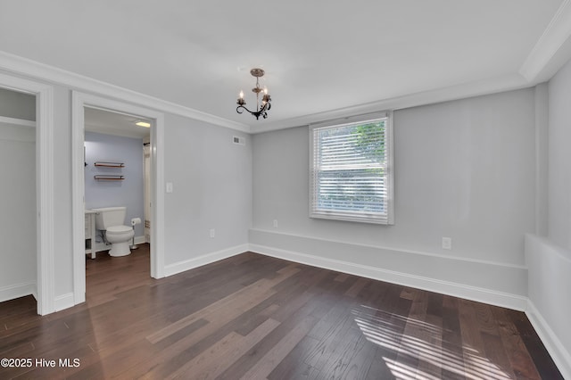 interior space featuring dark wood-style floors, visible vents, a notable chandelier, and baseboards