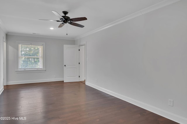 empty room featuring baseboards, a ceiling fan, ornamental molding, dark wood-type flooring, and recessed lighting