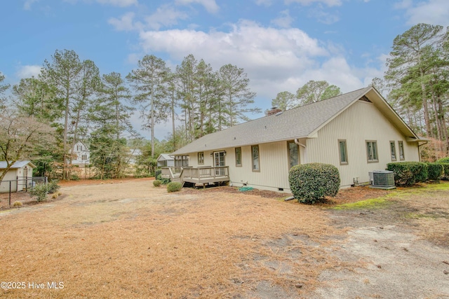 back of property with a deck and central air condition unit