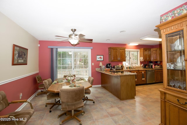 dining space featuring ceiling fan