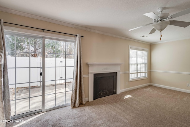 unfurnished living room featuring crown molding, carpet floors, a textured ceiling, and ceiling fan